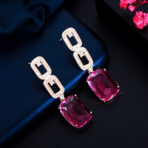 Boucles d'oreilles longues haut de gamme aux détails géométriques roses et rouges