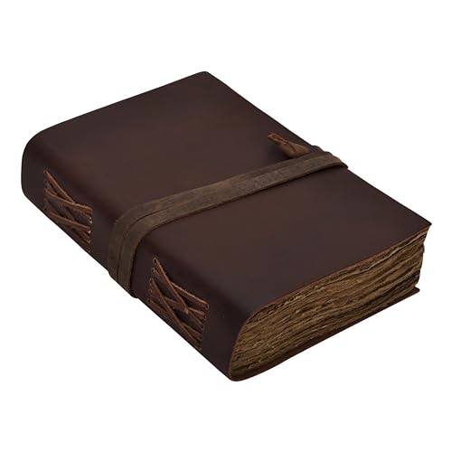 Carnet en cuir marron contre la panne d'inspiration pour art et écriture