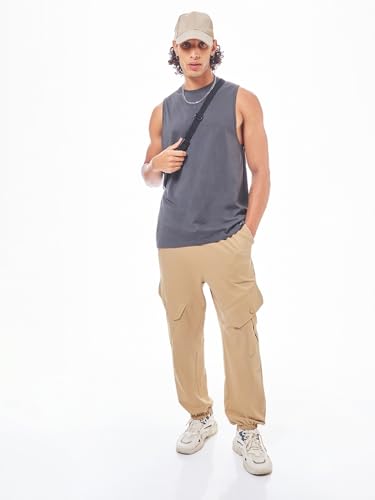 Image of Bewakoof Men's Cotton Super Loose Fit Joggers|Bewakoof Air 1.0 | Track pants for man | Lower for man | Trouser for men | Baggy trackpants for men | Multipurpose | Mens Lower Activewear | Utility Pockets | Lightweight & Flexible Elastic Waist | Casual Joggers | Loose Fit