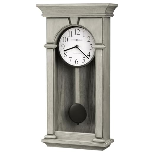 Howard Miller Mira Pendulum Wall Clock, White Analog Dial with Wooden Finish Wall Mount Single-Chime Movement, Metallic Bob Battery Operated Perfect Wall Clock for Home Decor, Living Room & Office