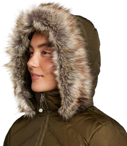 Woman wearing the Eddie Bauer Crystal Ridge Down Parka in a winter city setting.