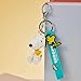 MINISO Snoopy Keychain Peanuts Bag Charm Summer Travel Collection Cute Bag Charm Key Chain for car key backpack birthday gifts (Sitting)