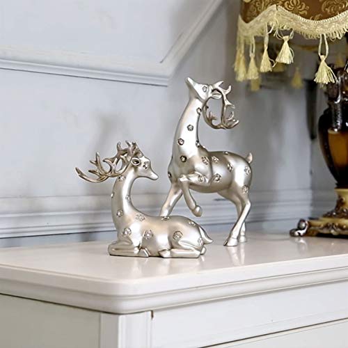 Décoration d'entrée élégante statue de cerf contre un meuble vide