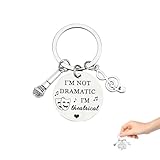 Idée cadeau théâtre : ce porte-clés est un cadeau chaleureux pour les amateurs de théâtre et de théâtre musical, idéal pour les acteurs, les actrices, les directeurs, les professeurs de musique et les étudiants. Il célèbre leur passion pour la scène avec un design ludique.