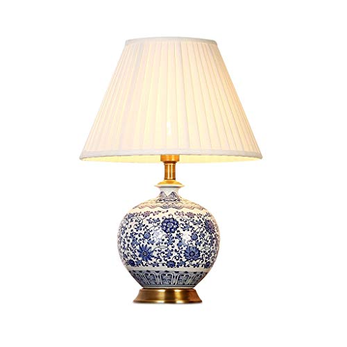 Lampe de bureau en céramique bleue et blanche avec socle en cuivre chic