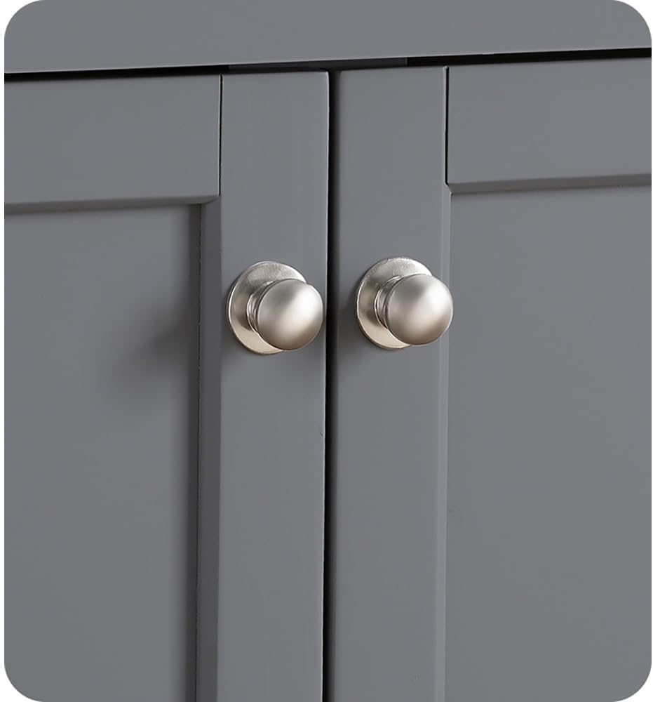 A close-up view of the brushed nickel knobs on the vanity cabinet doors.