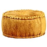 Ce pouf en velours sert de pouf et de siège.