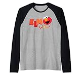 Personnage coloré qui associe un visage Elmo souriant avec des mots vivants et une énergie visuelle exceptionnelle. Idéal pour les collectionneurs, les fans d'animation et toute personne attirée par les images rétro pour enfants, les graphismes expressifs, le style ludique et l'attrait emblématique des marchandises