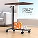 WOTURE Adjustable Overbed Table with Wheels, Bedside Rolling Table, Pneumatic Height Adjustment, Hospital Bed Table on Wheels, Standing Desk, Bedridden & Mobility Needs, Walnut