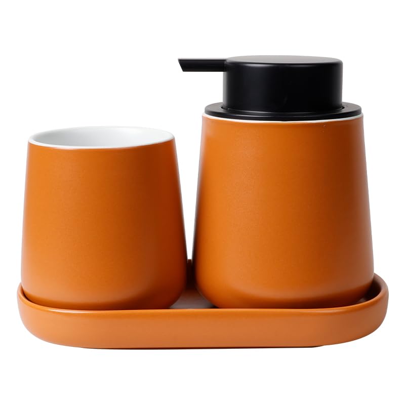 Ambiance spa à la maison avec l'ensemble de salle de bain en céramique orange et son plateau