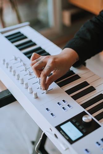 Image of Arturia KeyLab Essential 88 mk3 with 88 Velocity-Sensitive keys, 9 Encoders, 9 Sliders, 8 RGB Pads - USB-C, Midi Out, LCD Screen, Bundled Software and DAW Integration - White