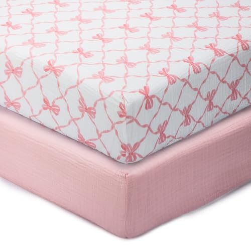 Image of LollyBanks Muslin Crib Sheets 2 Pack, Soft and Breathable 100% Cotton Crib Fitted Sheets for Girls, Cozy and Snug Baby Sheet for Standard 52"x28" Mattress, Registry (Pink Bow and Solid Pink)