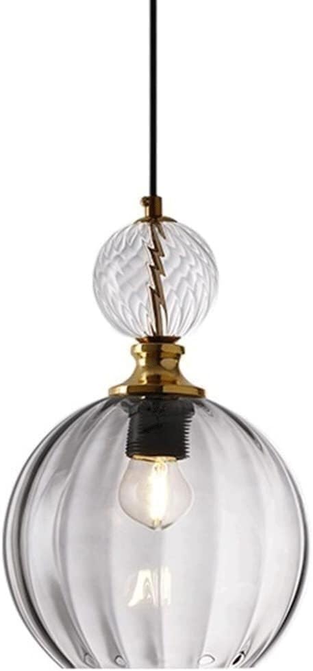 Lampe à suspension en verre à rayures pour éclairer un îlot de cuisine et sécuriser l'escalier