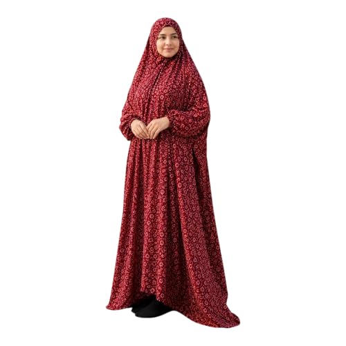 Maroon one-piece prayer dress with hibiscus print and flowing silhouette — shows the pull-on design worn over daily clothing