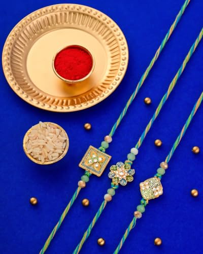 Image of Hyperfoods Rakhi for Brother with Dry Fruits Rawfruit's Handcrafted Potli Blue And Red with Thali Roli & Chawal Rakhi Gift Hamper for Brother Pack of 4 Cashew Almond Pistachios Raisins 495gm With Set of 3 Meena Rakhi