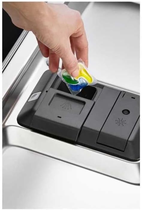 Hand placing a dishwasher detergent pod into the dispenser