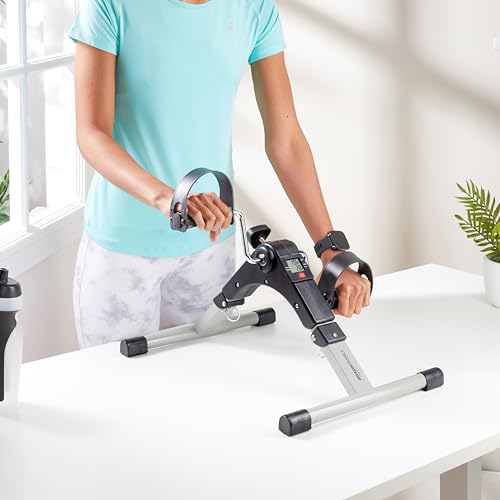 Image of Amazon Basics Mini Bike Digital Pedal Exerciser | Mini Cycle for Home Workout I Heavy Material with Fixing Strap, Adjustable Resistance & LCD Display | Versatile Workout Equipment | Black and Grey