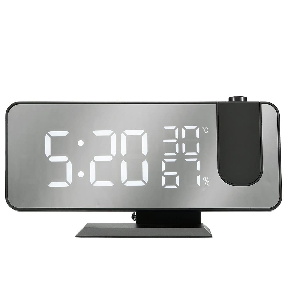 WE Projection Alarm Clock Radio displaying time 22:59, temperature 23°C, and humidity 20%, with a red projected time 22:59 on a surface above, and a smartphone charging via USB cable.