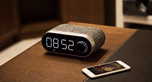 REMAX RB-M26 speaker on a bedside table displaying 08:09