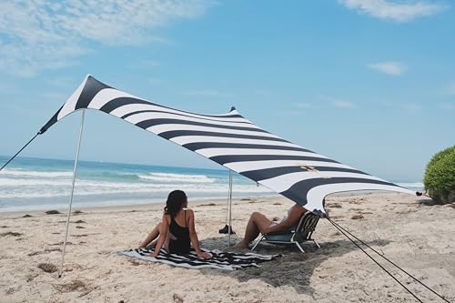 Image of Neso Portable Beach Tent Sun Shelter with Sand Anchor - Lightweight Beach Shade Canopy - Easy Setup for Family Outings - Patented Reinforced Corners - UPF 50+ - 7 x 7ft - Black /White Stripes