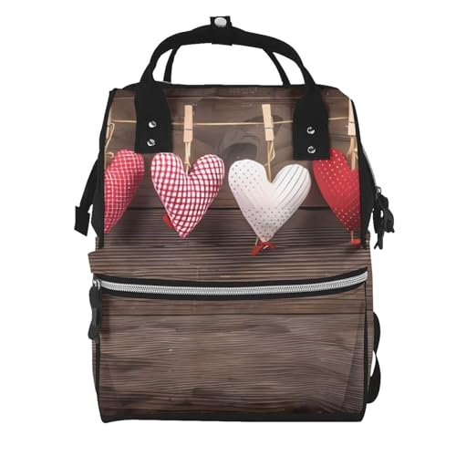 Sac à dos à langer noir imprimé cœurs pour les promenades et voyages des parents