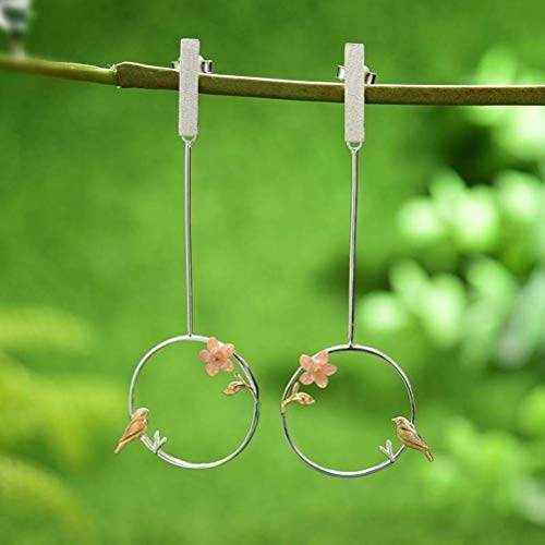 Boucles d'oreilles fleur et oiseau en argent pour tenue chic