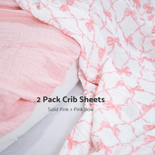 Image of LollyBanks Muslin Crib Sheet, 100% Cotton Fitted Crib Sheets for Girls | 2 Pack, Soft airy weave, flexible elastic hem on 52 x 28 in standard mattresses (Pink Bow and Solid Pink)