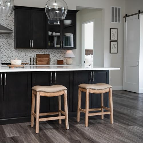 Image of Maven Lane Adrien Backless Counter Stool - Set of 3 - 26 Inches - Saddle Stool with Footrest - Brown Solid Wood Frame & Beige Faux Leather Upholstery - Perfect for Kitchen Islands & Counters