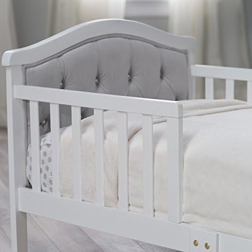 Orbelle Padded and upholstered Head and Footboard Upholstery is Ultra-Soft Micro-Fiber Polyester Decorative Crystal Dimensions: 53L x 30W x 27H in White Finish Fits a Standard Crib Mattress