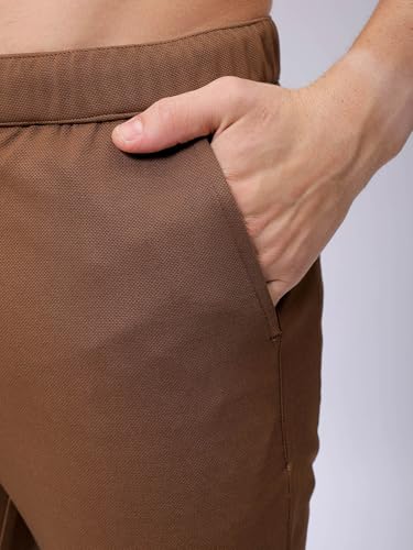 Image of The Indian Garage Co Men Slim Fit Solid Mid-Rise Stretchable Knitted Jogger Trousers