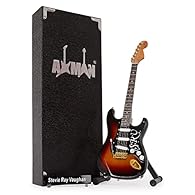 CRAFTED WITH PRECISION: This 10in/25cm wooden Miniature guitar with plastic and metal details includes a display stand, making it perfect for showcasing. Each order contains a handmade mini guitar, stand, display box, and artist name plate with 2 acr...