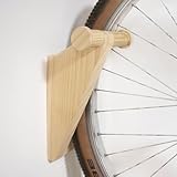 Solution de rangement complète : Ce support vélo mural permet de regrouper vélo et accessoires au même endroit pour une organisation claire et fonctionnelle.