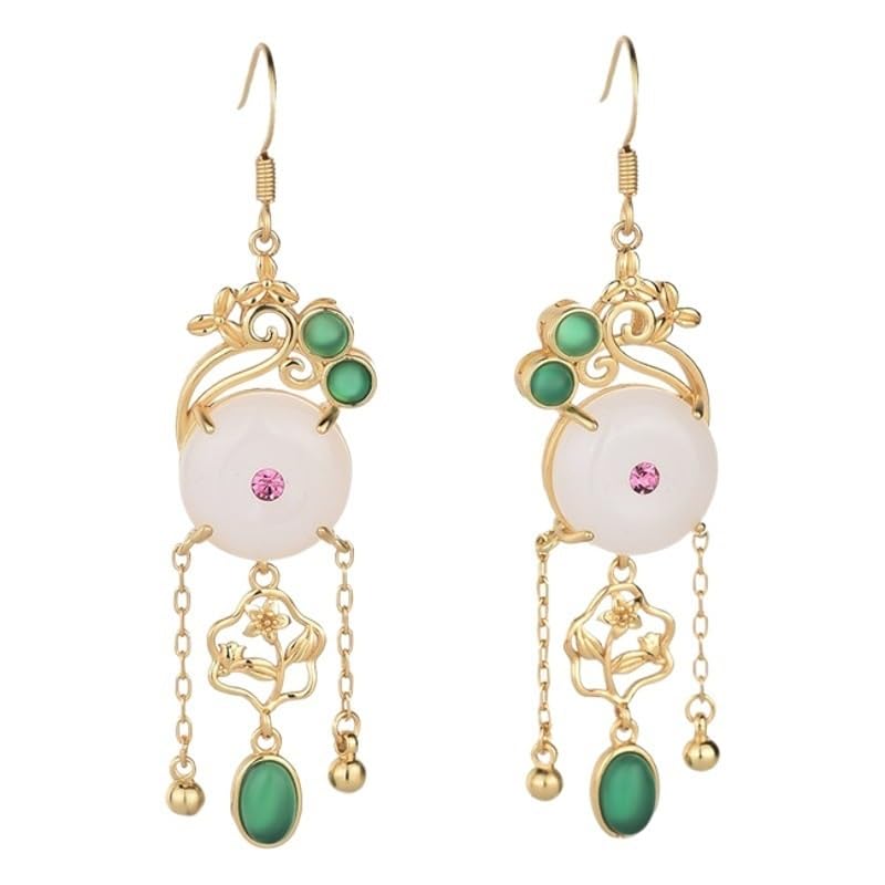 Boucles d'oreilles pendantes pierre blanche d'une brillance dorée d'exception