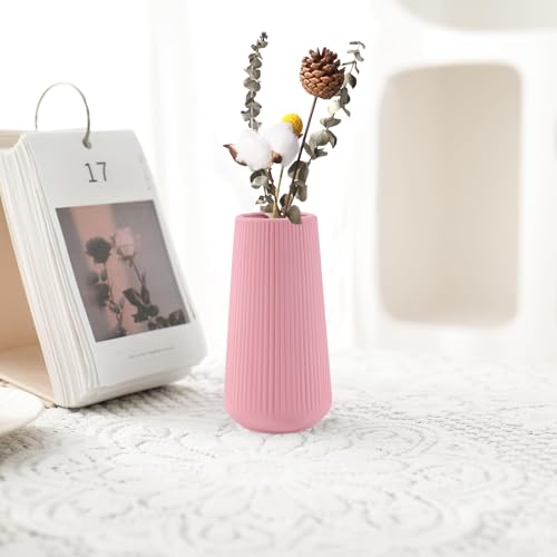 Vase en céramique rose compact pour sublimer les petits espaces et étagères
