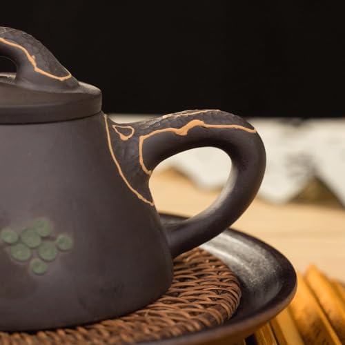 Kettle pot traditionnel en céramique d'art avec infuseur de thé