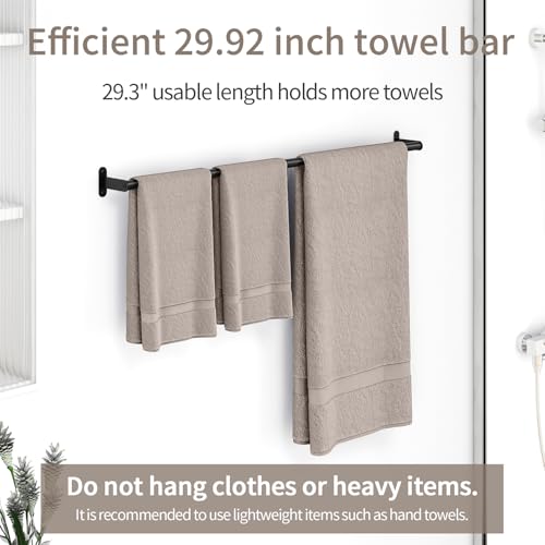 Matte black bar holding two rolled towels perfectly