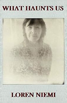 Paperback What Haunts Us Book