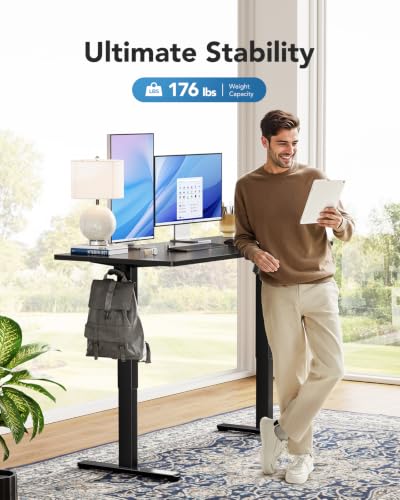 Image of HUANUO Electric Standing Desk, Whole Piece Desktop, Adjustable Height Computer Desk, 4 Height Memory Settings, Sit Stand Up Desk for Home Office, 48 inch x 24 inch, Black (Pack of 2)
