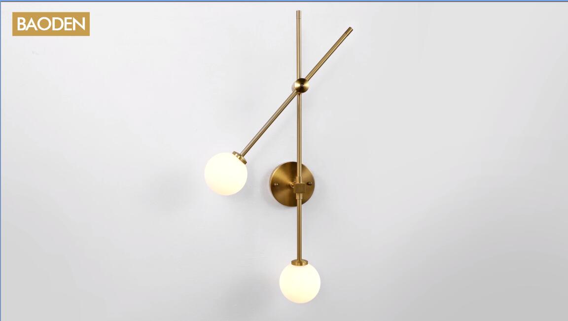 Image of Modern 2 Lights Globe Wall Sconce Industrial Wall Lamp with G4 Bulb Mid Century Rotatable Light Fixture Brushed Brass Finished White Globe Glass Shade (Gold Color)