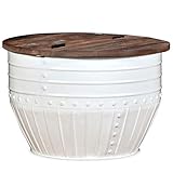 Su exclusiva base en forma de barril proporciona a la mesa un toque industrial.Esta mesita auxiliar tiene una superficie de madera maciza, ideal para colocar vasos, jarrones, frutas u adornos, mientras que el compartimento de almacenaje oculto debajo de la superficie proporciona espacio extra para mantener el desorden a raya.La superficie está hecha de madera maciza reciclada, lo que significa que cada mesa es única y ligeramente diferente a la anterior