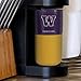 Rico Industries NCAA Washington Huskies Personalized 16oz Purple Ceramic Tumbler with Gold Silicone Grip, Deep Laser Engraved Logo, Travel Coffee Mug with Slide Lid, Matte Glaze