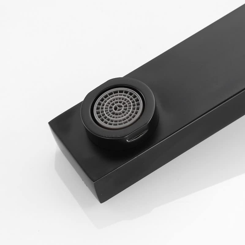 Close-up view of the faucet aerator at the end of the spout