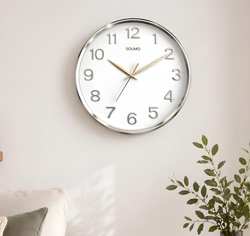 Image of Amazon Brand - Solimo 12 Inches Silent Wall Clock for Living Room Bedroom Office Plastic Easy to Read 3D Numbers Modern Stylish Sweep Movement Wall Clock for Home 1603DX (Silver)