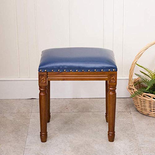 Tabouret de courtoisie en bois bleu autour de la table de repas