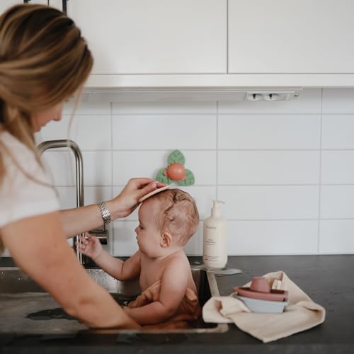 Image of mushie Dino Suction Spinner Toy | Toddler Sensory Toys for Bath & Play