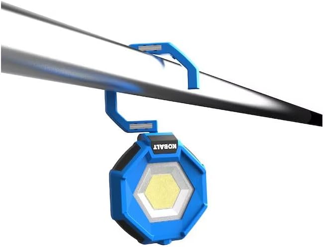 Kobalt work light hanging from a pipe, demonstrating the integrated hook.