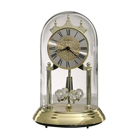 Howard Miller Christina Gold Anniversary Table Clock 645-690 - Polished Brass Finish, 9 Inch Dome, Pendulum Includes 4 Revolving Crystals, Quartz Movement