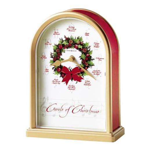 Howard Miller Carols of Christmas II Table Clock 645-424 – Satin Brass Finish, Red Marble Tone Sides, Decorative Wreath Center, 12 Musical Carols, Quartz Movement