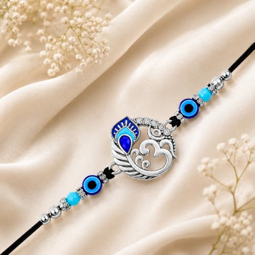 Image of Riddhika Ventures Alluring Gold Plated Om and Pearl Rakhi with Roli Chawal & Greeting Card for Men (S1)