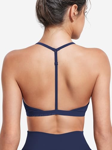 Image of YEOREO CoreFlex Sports Bras for Women Strappy Padded Halter Open Back Light Impact Deep V Neck Yoga Workout Gym Tops